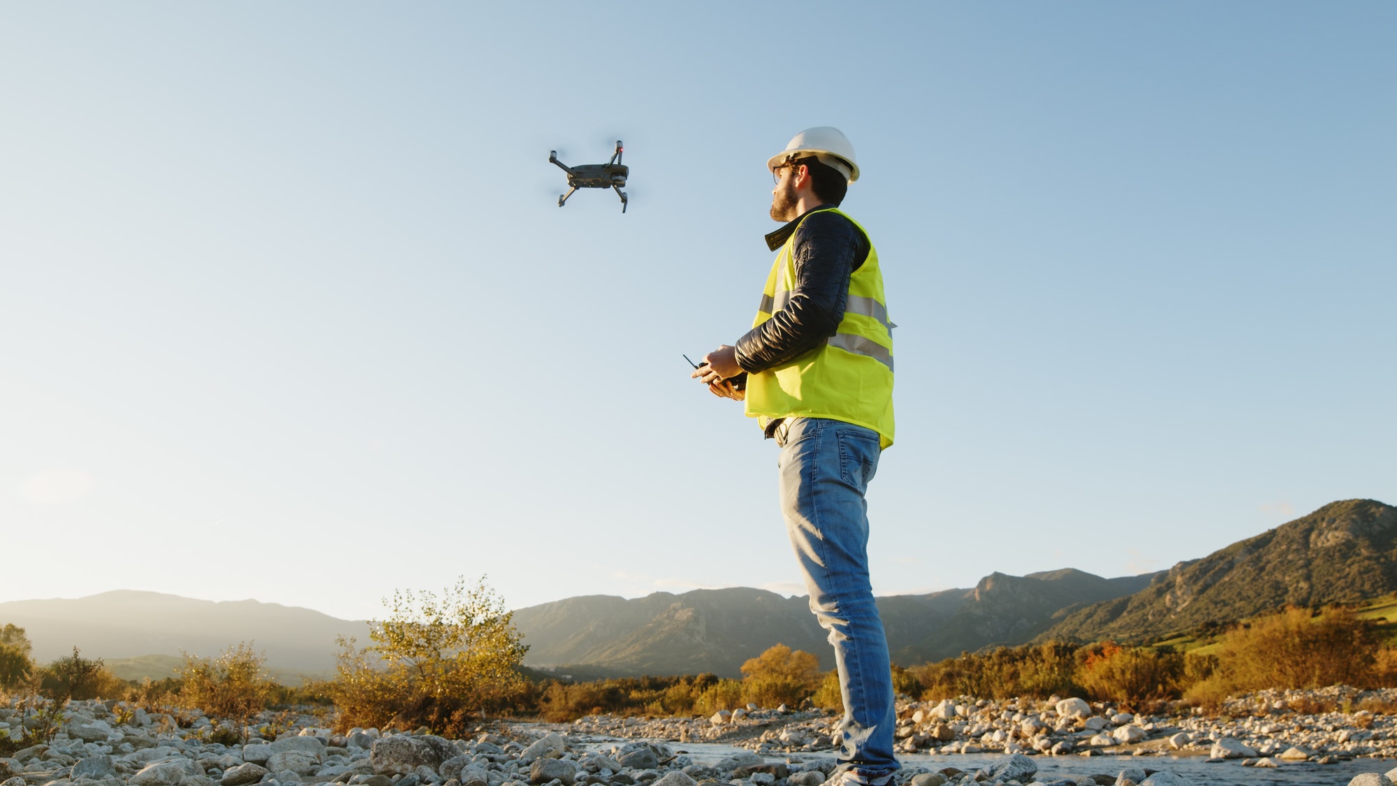 geologist with drone checks the territory